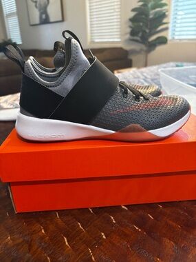 Nike womens Gray, Black, and orange Slip-On Athletic Sneakers